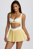 Soft Active Crossover Pleated Mini Skort in Lemon